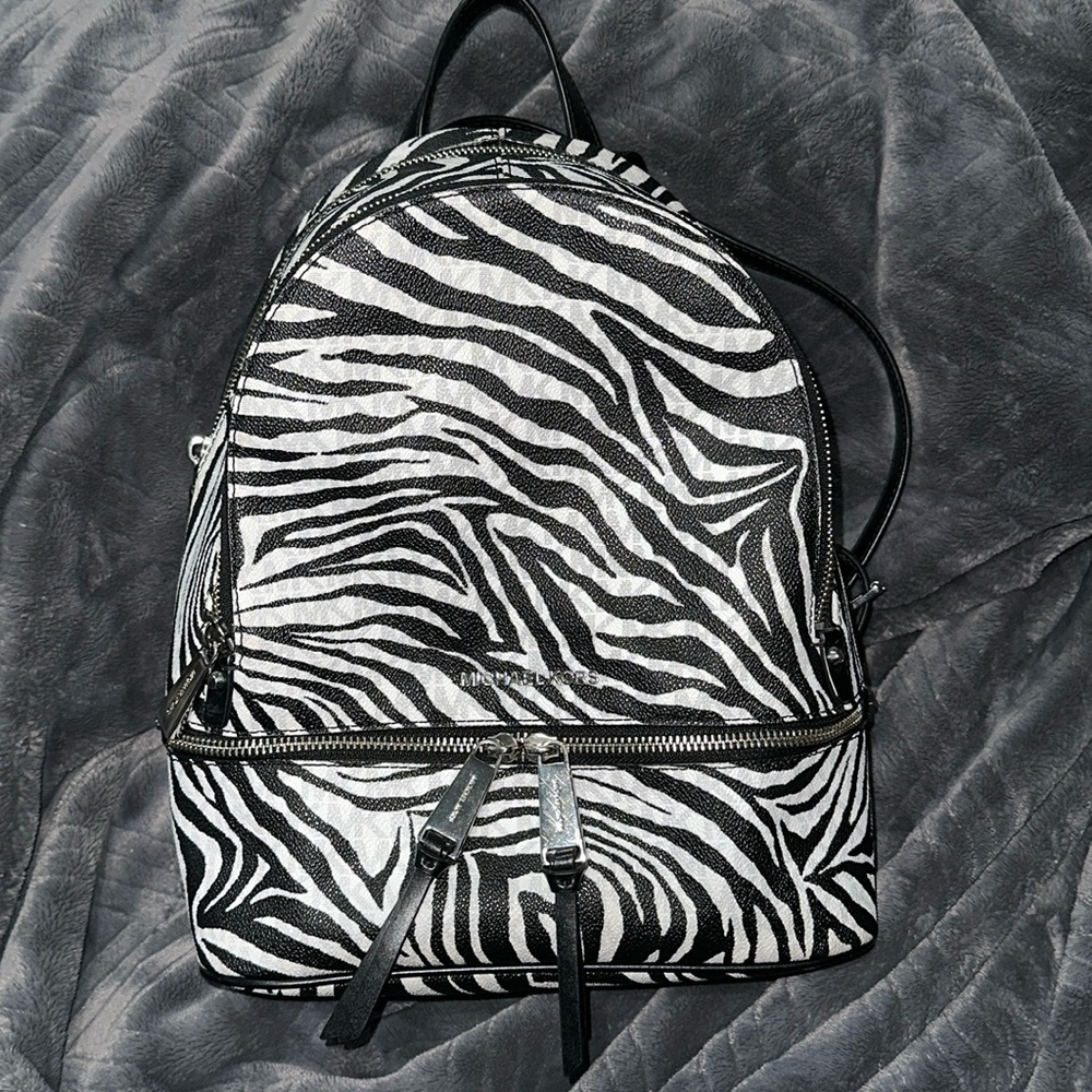MICHEAL KORS ZEBRA RHEA MEDIUM BACKPACK BRIGHT WHITE AND BLACK